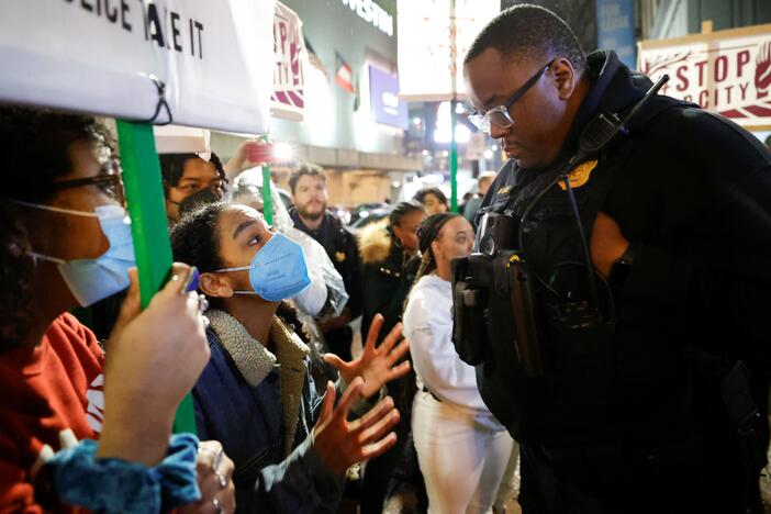  Demonstrators confront an Atlanta police officer during a protest over plans to build a new police training center, March 9, 2023