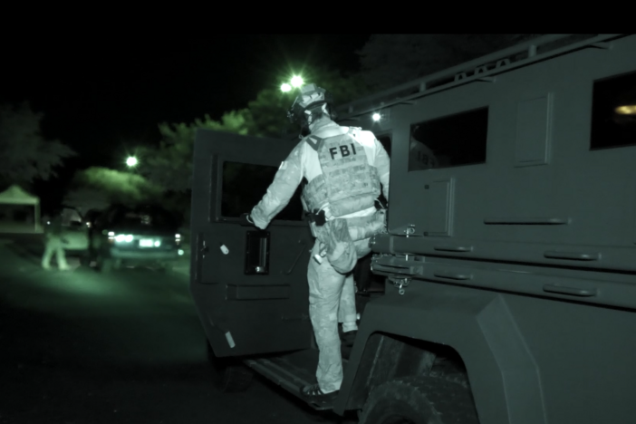 A still from video of the FBI operation in Savannah against a large group of gang members.