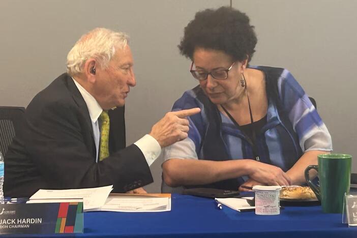Jack Hardin, left, chairman of the Fulton County Board of Health, speaks with District Health Director Dr. Lynn Paxton at a board meeting on April 23. (Rebecca Grapevine / Healthbeat) 