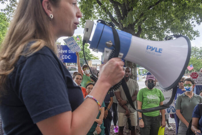 A mix of former and current CDC employees rallied across the street from the CDC main campus Tuesday to call for the resignation of Secretary of Health and Human Services Robert F. Kennedy, Jr. on the afternoon following Kennedy's disbanding on the CDC advisory panel on immunizations. 