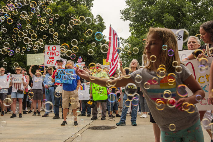 People gathered Saturday in the same strip of downtown park used for a political rally nearly every weekend since the Hands Off protests in April for the Macon, Ga. (Pop. 157,000) No Kings event. Grant Blankenship/GPB News