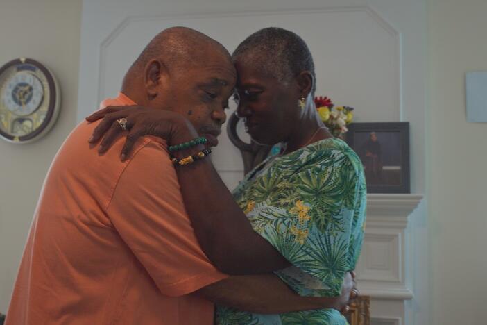 Caregiver Malcoma Brown-Ekeogu and her husband, Kenneth, dance on their wedding anniversary. Both are featured in CAREGIVING.