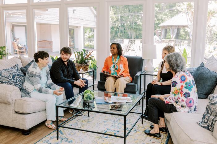 People sitting on couches talking