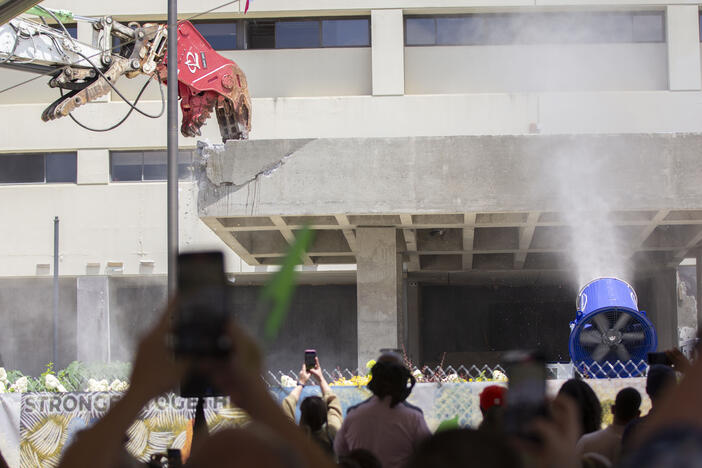 A concrete portico at one of the former main entrances of Wellstar Atlanta Medical Center is torn down on June 30, 2025. The demolition project of the 1.8 million square foot site got started after a years-long moratorium from the city.