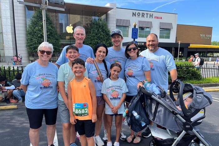 The Turner Family wearing blue custom shirts for the Peachtree Road Race