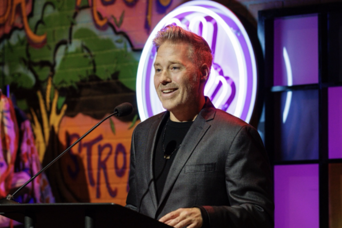 Tamlin Hall, founder and executive director of Hope Givers, speaks at the Hope Givers Awards Ceremony