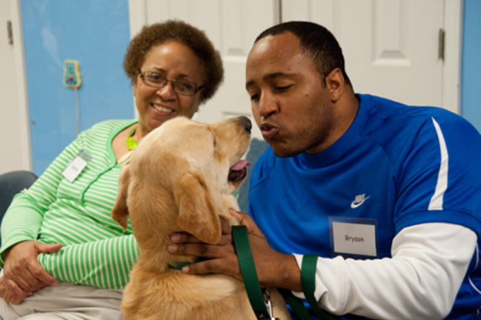 Bryson Casey with his dog Wagner during a training session at Canine Assistants. Photo courtesy of David Scott.