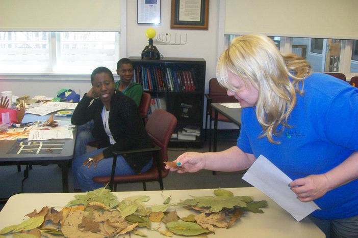 Teachers at a hands-on training at Charlie Elliot Wildlife Center