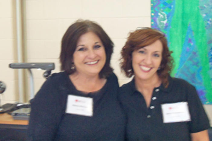 Organizers Wanda McClure and Nikki Robertson take a break for the cameras.