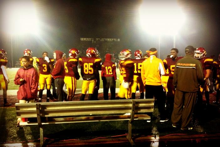 The Lassiter Trojans fell to the Peachtree Ridge Lions in a rainy first round playoff meeting.