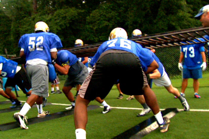 The McEachern Indians spend quality time on the field in preparation for Saturday's contest against the Brookwood Broncos.