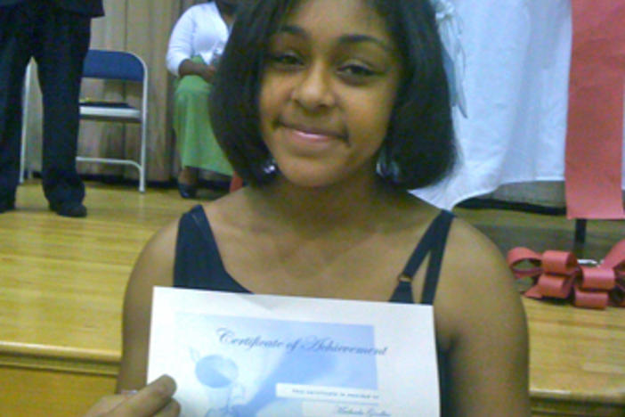 My goddaughter Machaela Goodbee shows off her honor roll certificate. Way to go Machaela!