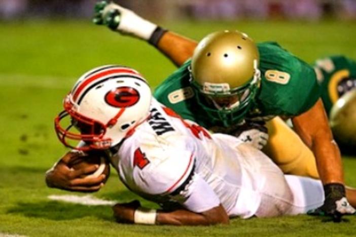 Gainesville Quarterback Deshaun Watson is taken down by a tackle on a carry.