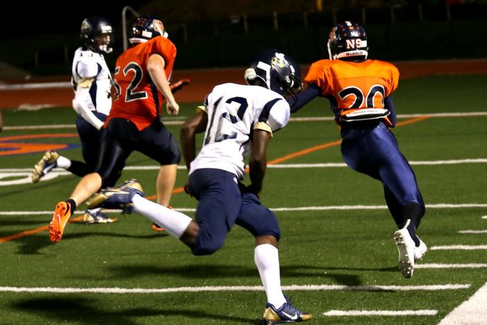 North Springs' Fabian Lumpkin returns an interception to score with 1:30 left to seal a Spartan victory. Photo by: David King