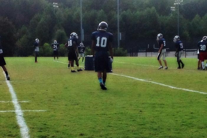 Ty practices with the linebackers Wednesday before his team meets their rival McEachern Indians at Northcutt Stadium