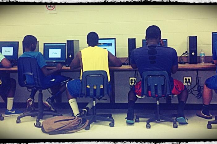 Chattahoochee High School football players take the baseline test on computers