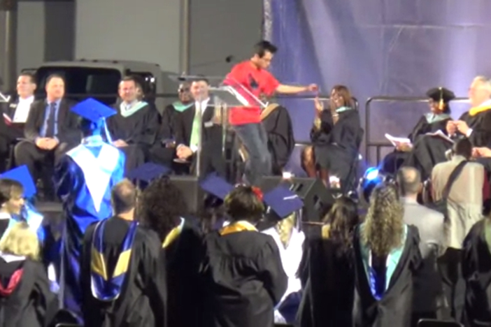 Parker Pitisci dances across his graduation stage.