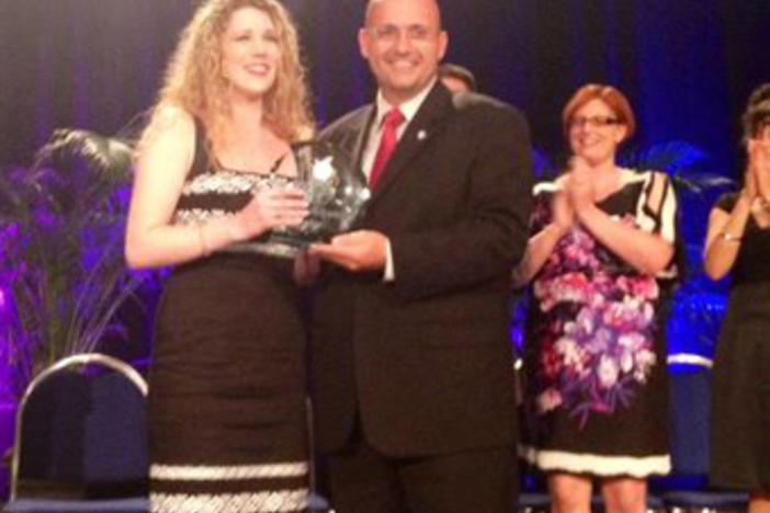 Lauren Eckman (left) receives the Georgia Teacher of the Year award from Superintendent John Barge (Courtesy facebook.com/gadoe