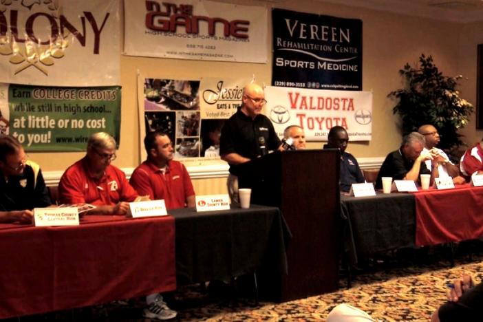 Mark Dykes addresses fans and media gathered to hear from some of South Georgia's most highly-esteemed football coaches.