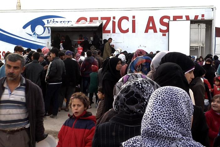 Hundreds of thousands fleeing war find humanitarian aid—and suffering—across the border.