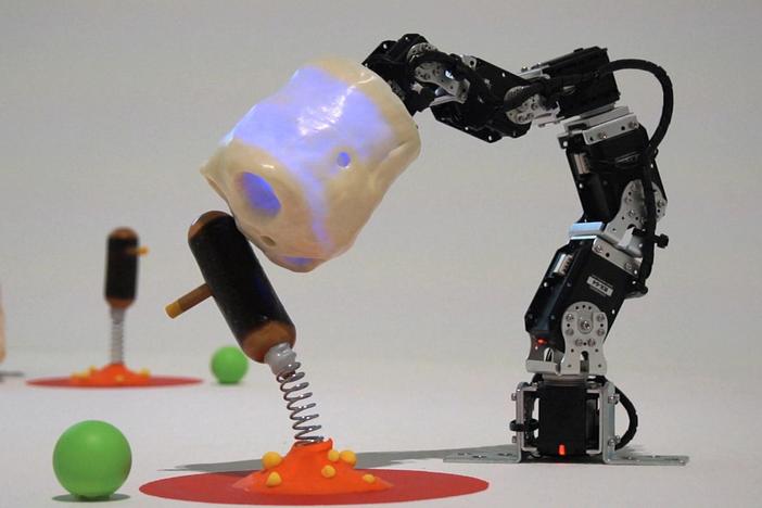 David Lynch puts a literal face on the oddest collection of little learning robots.