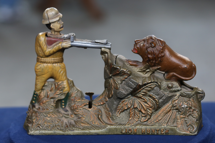 Appraisal: J. & E. Stevens Lion Hunter Bank, ca. 1910, in Harrisburg Hour 1.