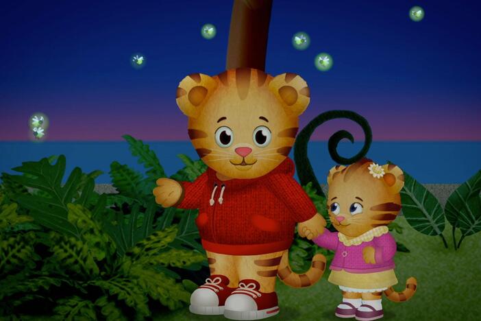 Margaret is afraid of the fireflies. Daniel holds her hand and that helps. 
