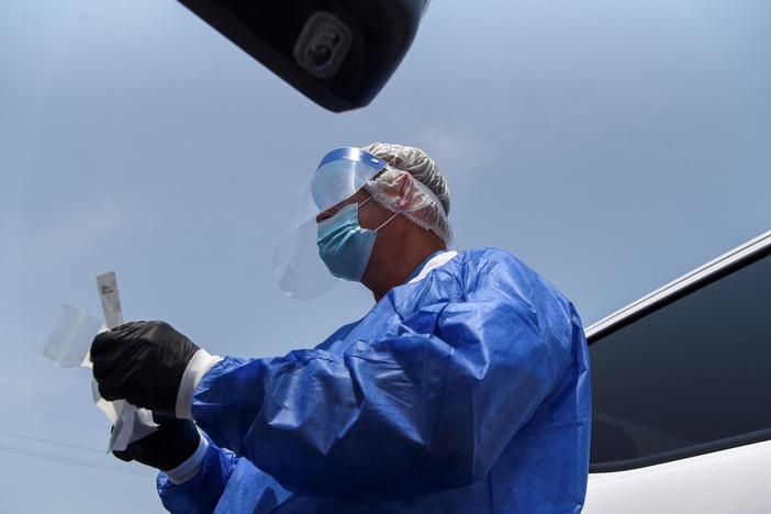 News Wrap: A surge in COVID-19 infections is pushing hospitals to the breaking point