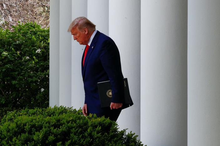 Trump warns of more 'very tough' days ahead as death toll passes that of 9/11