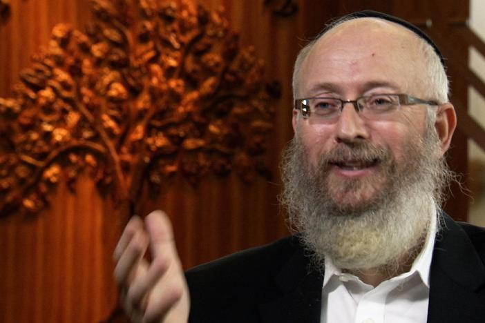 He talks about the importance of celebrating the Jewish festival of lights publicly.