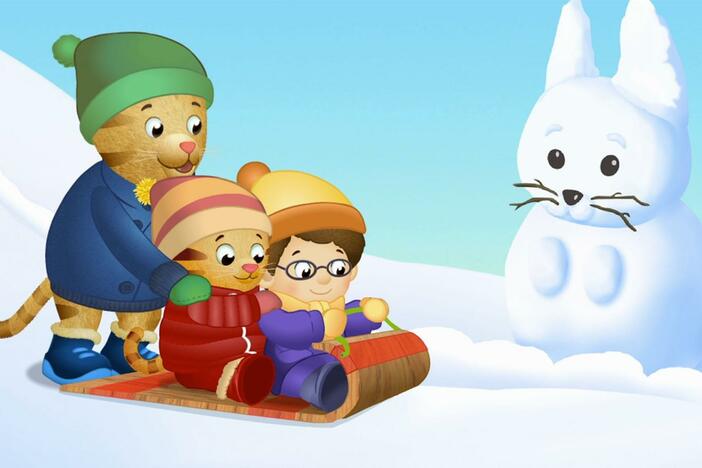 Daniel and Prince Wednesday try sledding down the big hill a little at a time.
