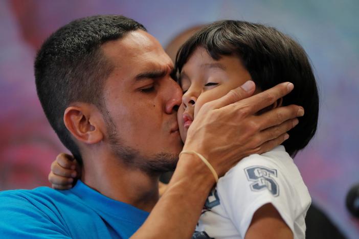 News Wrap: Deportations of reunited families temporarily halted by federal judge