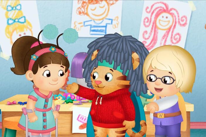 Everyone is playing beauty parlor. Chrissie puts a wig on Daniel and he looks different!
