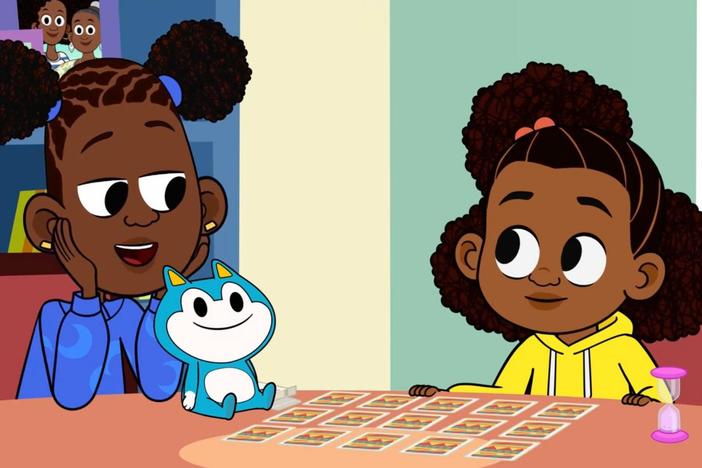 Lyla explains to her family the rules to her card game