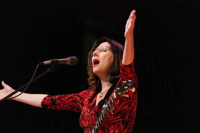 Songwriter Kelleigh McKenzie sings part of "All Is Changing, We Are Witness, We Are Life."