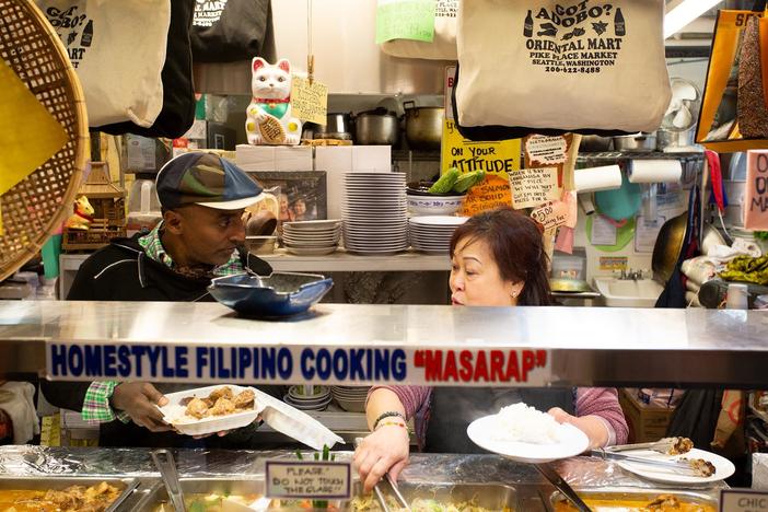 "Tita" Leila shows Marcus the ropes at Oriental Mart.