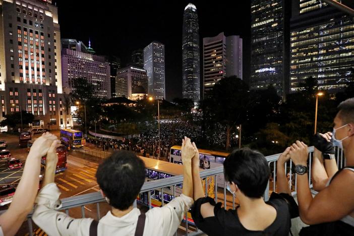 News Wrap: Democracy supporters in Hong Kong form human chain extending 25 miles