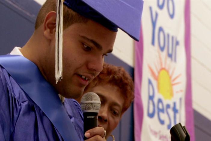 Janet Mino's class graduates from JFK High School.