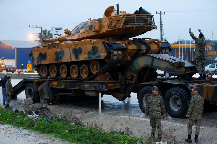 Turkey's military appeared ready on Friday to invade a Kurdish area of Syria.