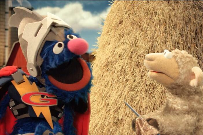 Super Grover helps find a sheep's knitting needle with the use of a magnet.