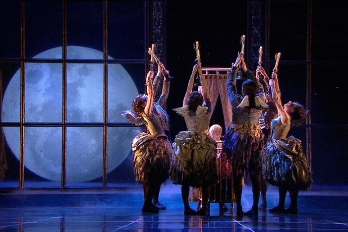 Fairies dance for baby Aurora in Matthew Bourne's Sleeping Beauty.