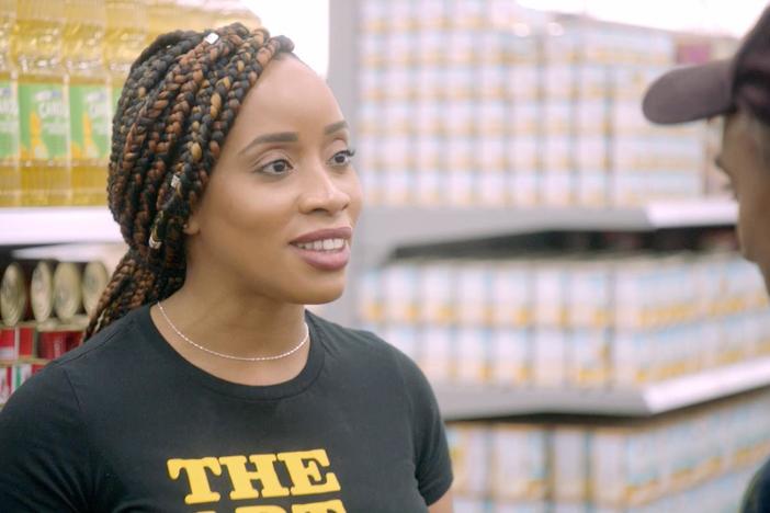 Kemi Ariyo, manager at Wazobia Market, shows off her jollof rice. Kavachi tells sad story.