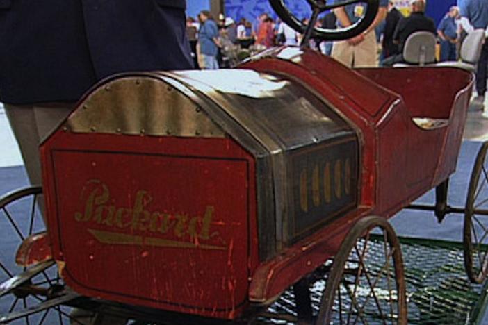 Noel Barrett appraises a Pioneer Packard toy pedal car for $5,000 to $6,000.