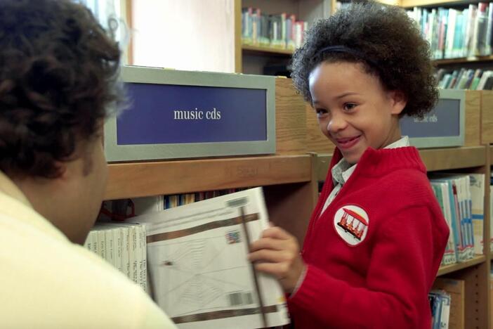 Olivia visits the library where she meets Chris, the librarian.