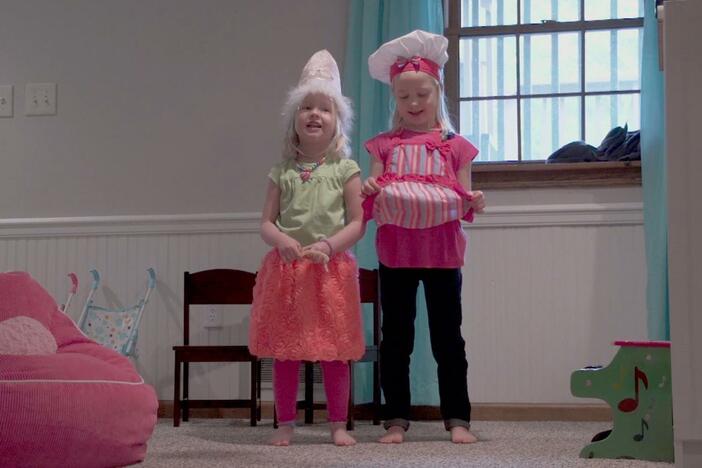The sisters want to put on a show for Mom but both want to wear the same dress up clothes.