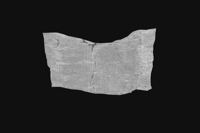 Researchers use AI to decipher ancient scroll buried in ash by Vesuvius eruption