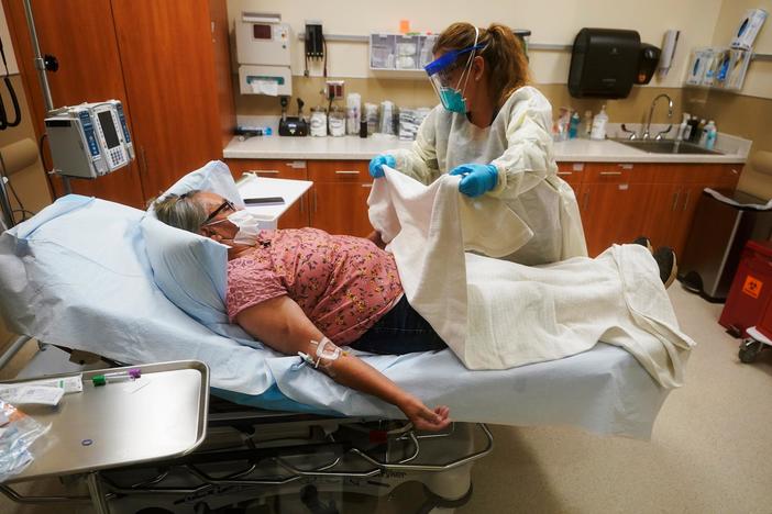 Overwhelmed by COVID patients, Alaska's health care workers also face harassment