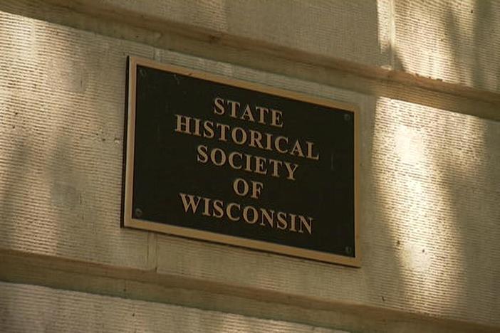 Host Mark L. Walberg meets with Anna Koski of the Wisconsin Historical Society.