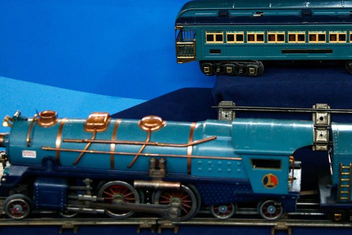 Leila Dunbar appraises a Lionel Blue Comet Train, ca. 1935.