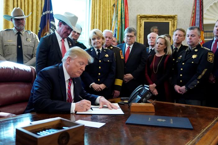 News Wrap: Trump issues first veto; North Korea warns it may restart missile testing
